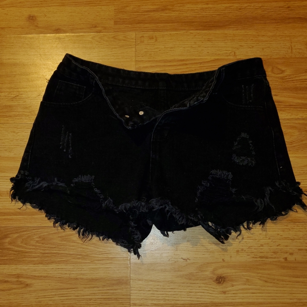 Black ripped shorts